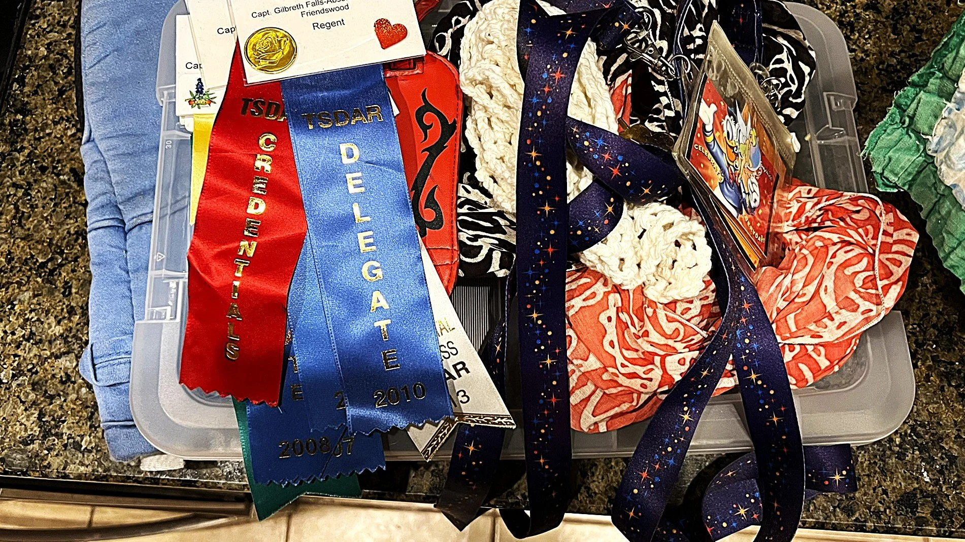 A colorful collection of material in reds and blues and purple.