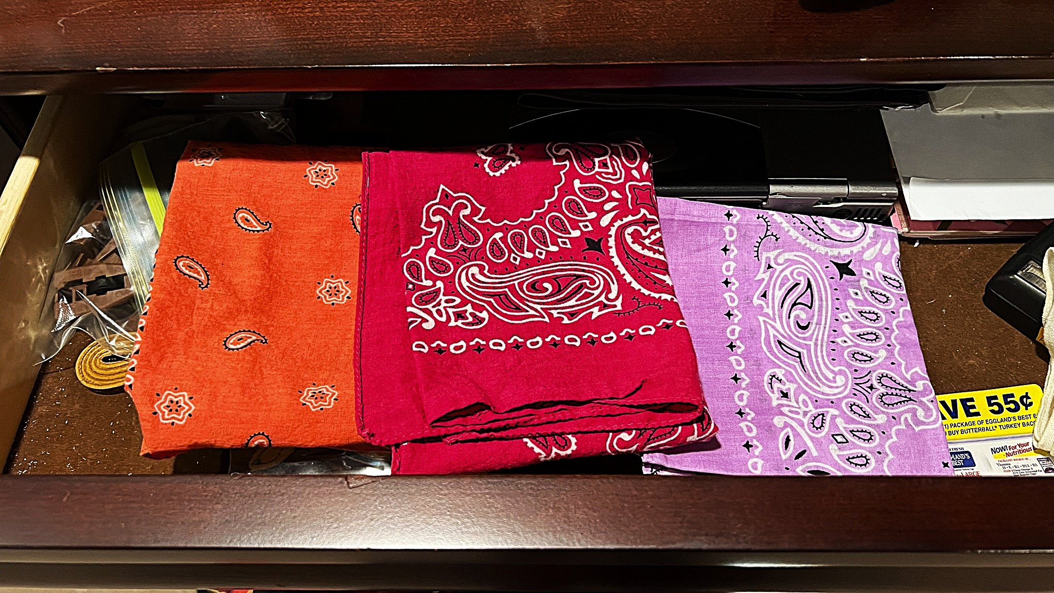 Bandanas in a drawer. red and purple.