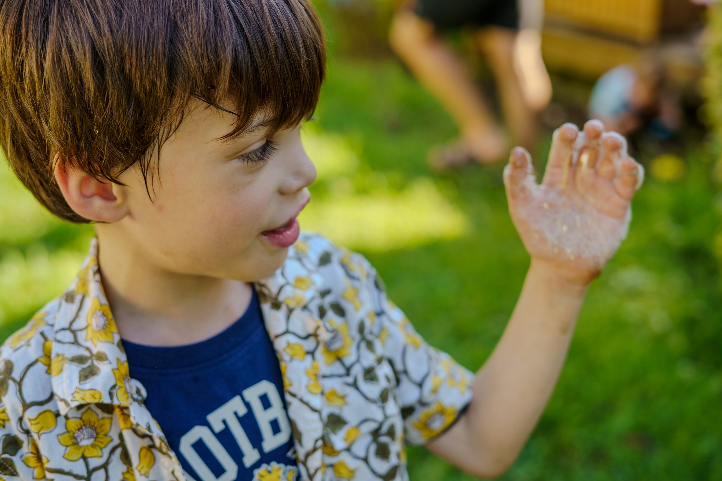 Bud put "magic" on the kids' hands so they could catch bubbles