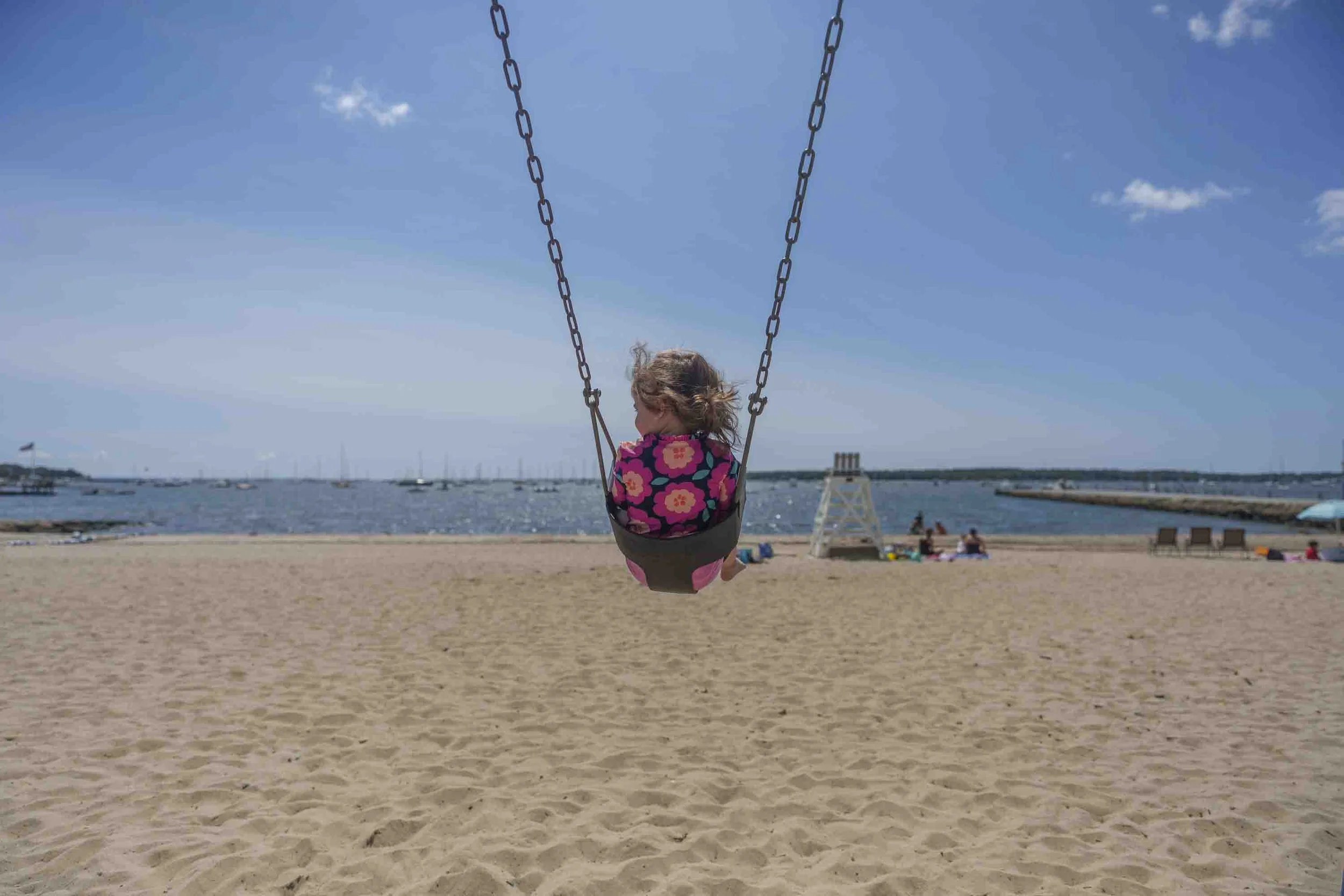 Elles's favorite thing to do.  She loves swinging and staring at the ocean at Town Beach. Dad loves it too! 8/21