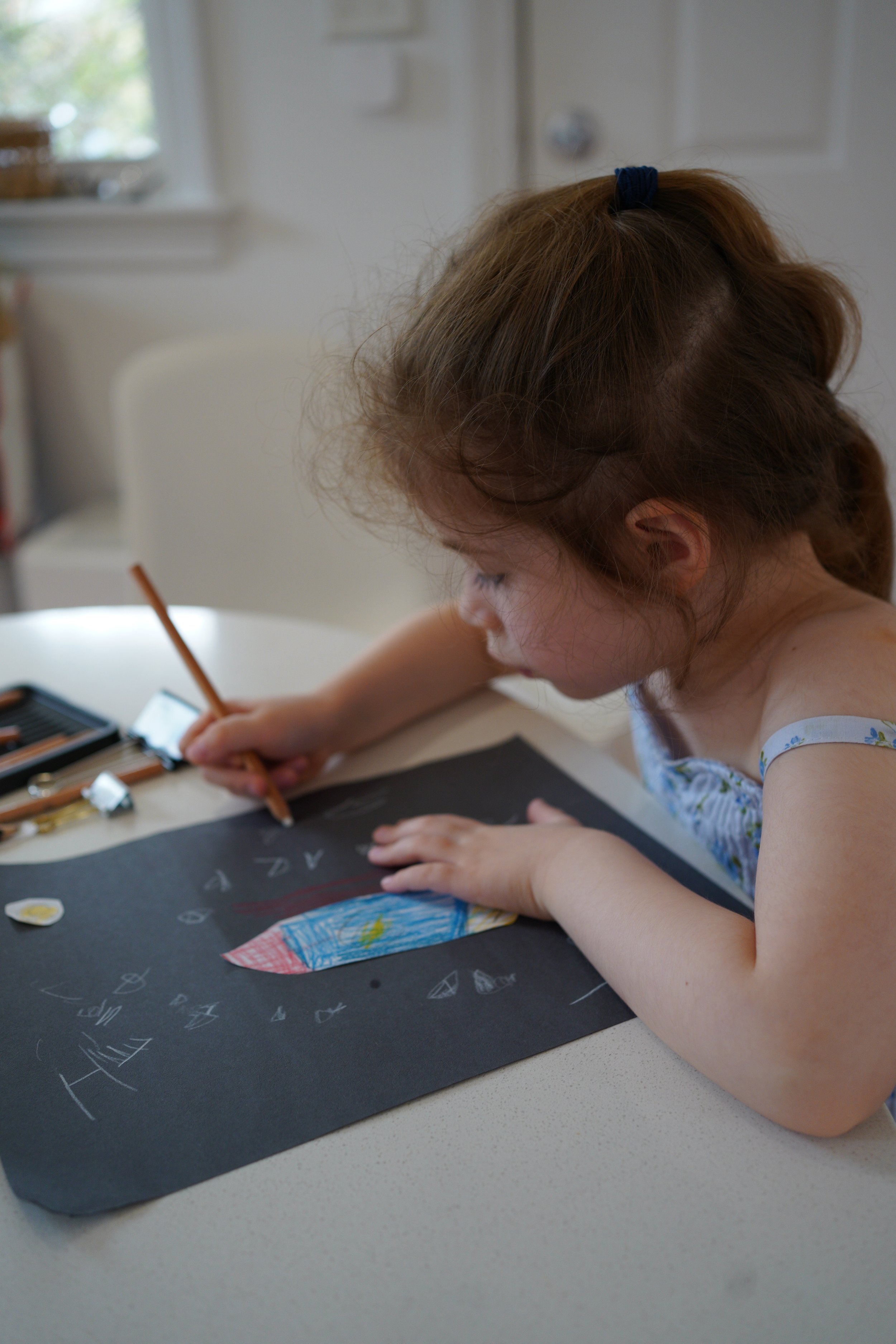 River and Eleanor are making a card for a friend