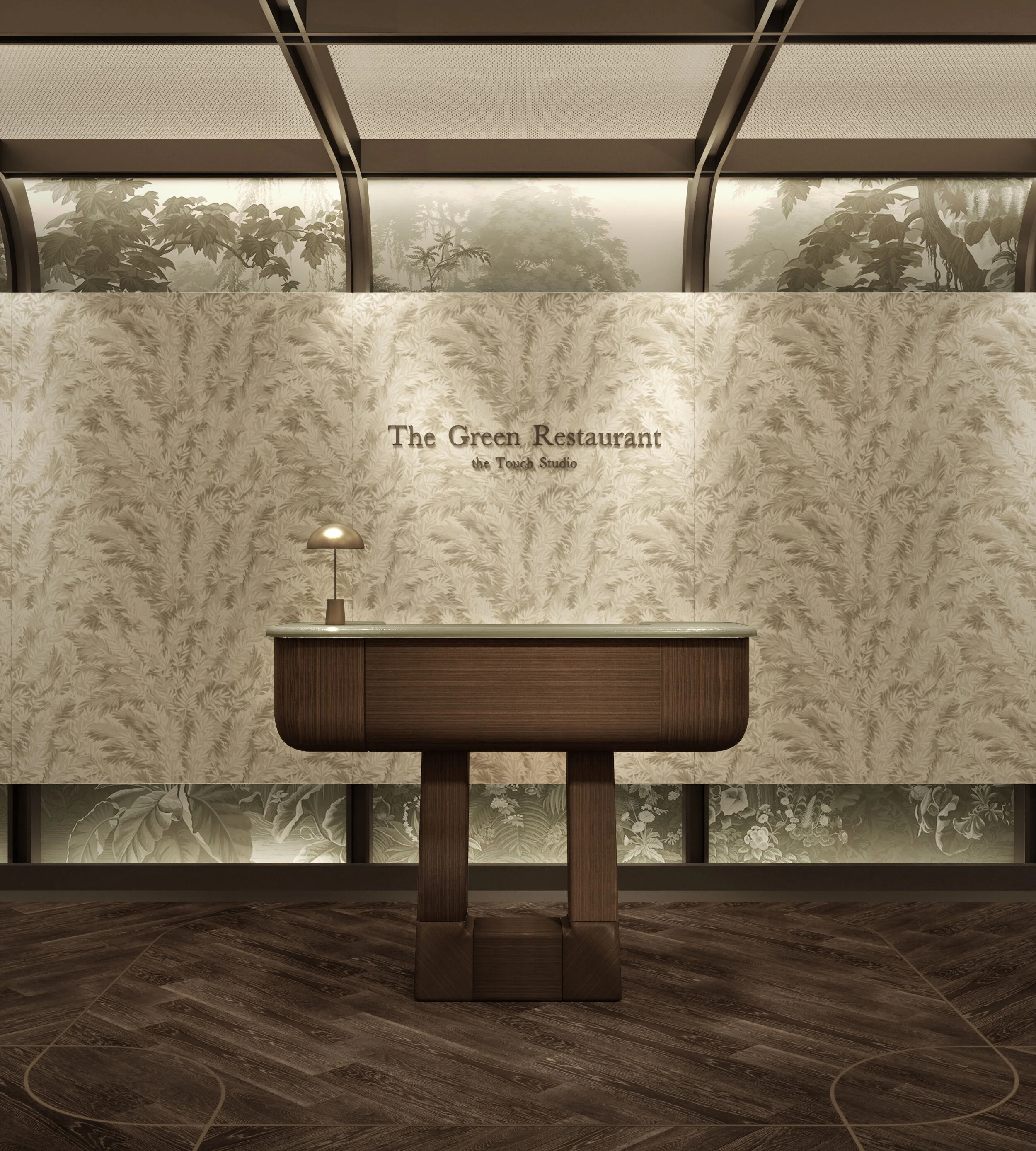Entrance reception desk at The Green Restaurant featuring a custom wooden host stand, brass table lamp, botanical wall covering, and studio branding.