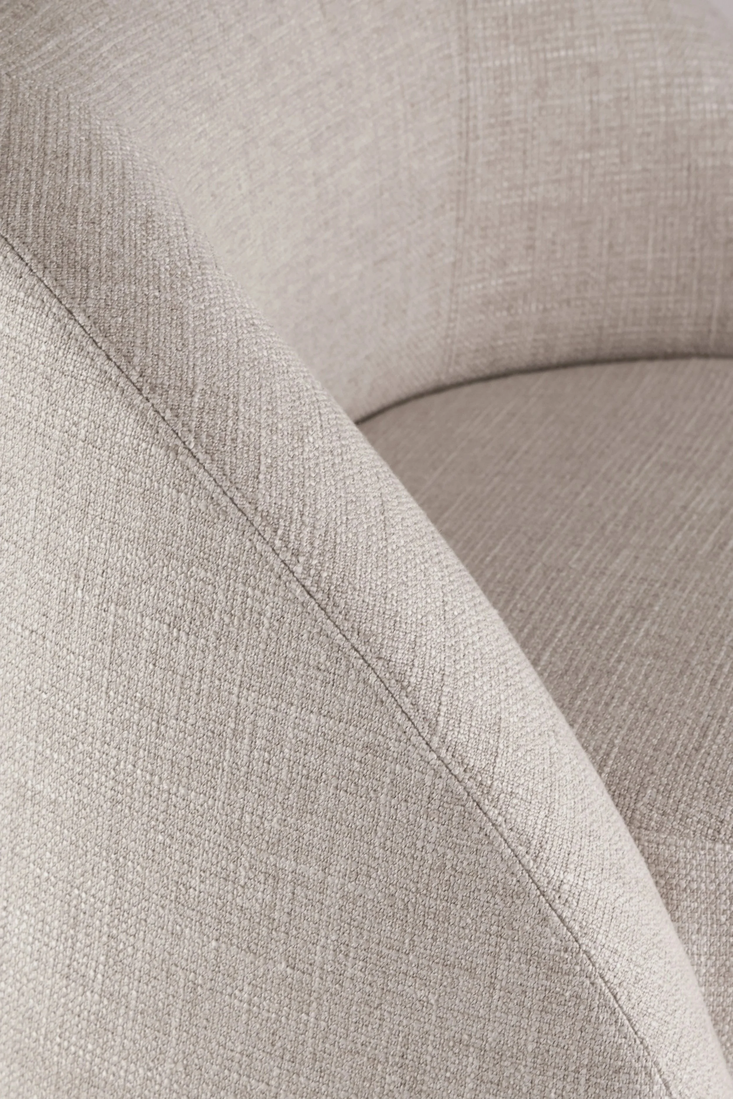 Close-up on the enveloping interior curves of the Petal armchair backrest, engineered for exceptional comfort.