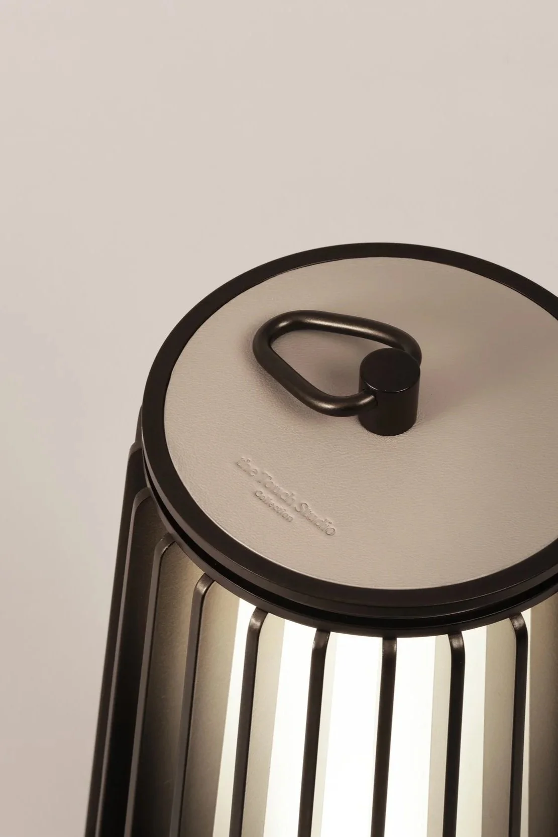 Detail of hand-finished leather handle, Dune Lantern, made in Italy