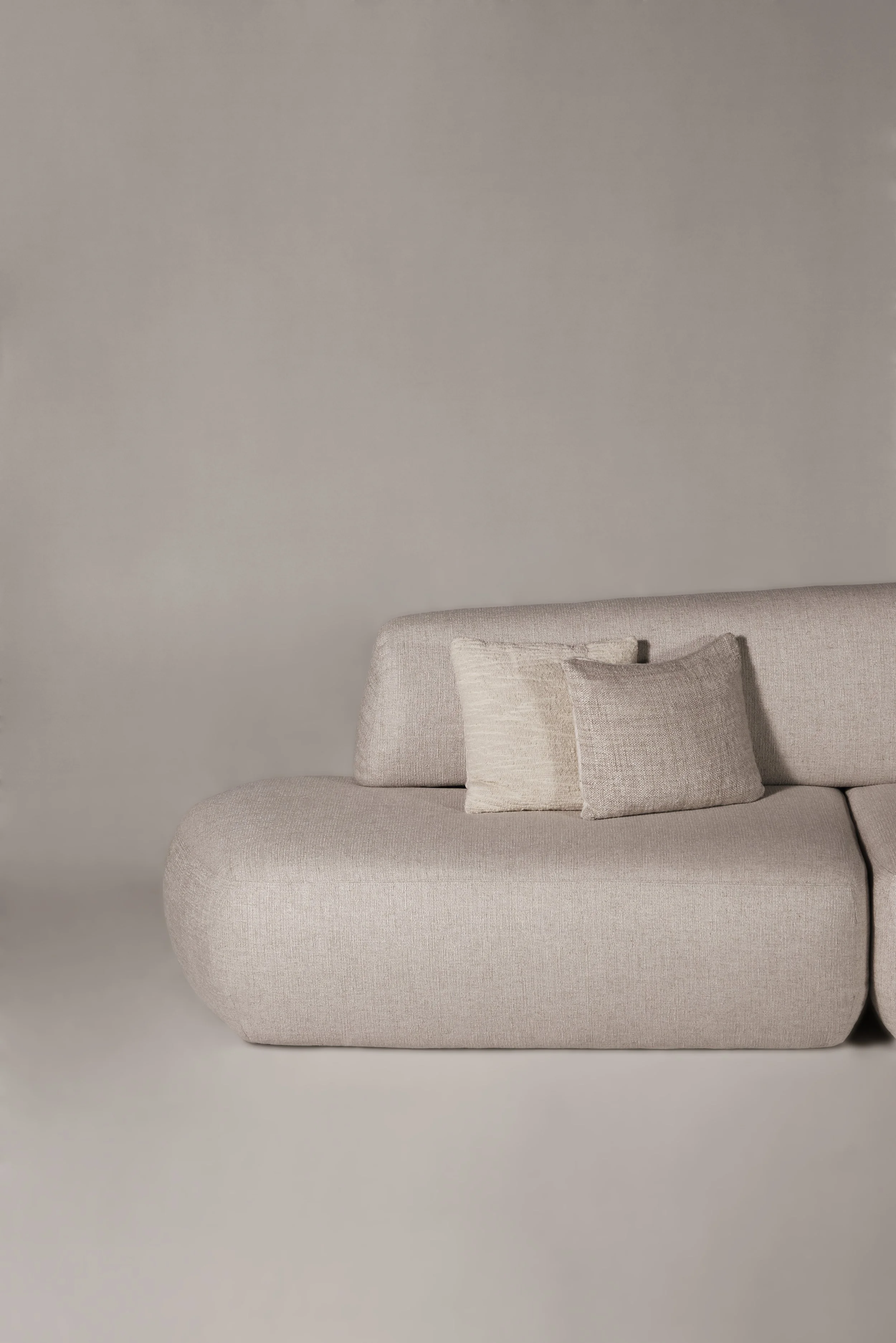Close-up detail of the Sekitei Sofa seating and backrest, showing the premium textured upholstery and welcoming, seamless volumes.