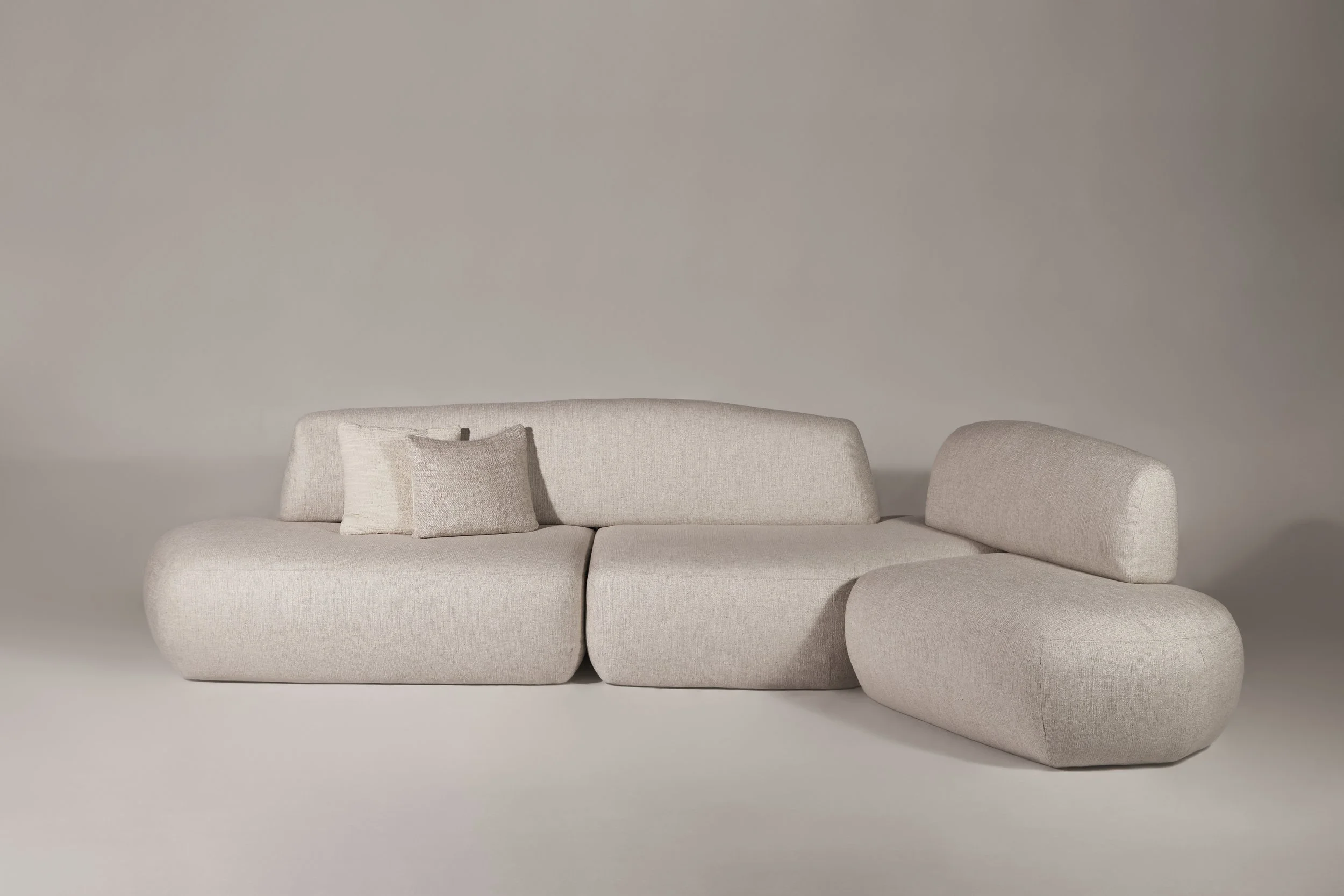 Sekitei Sofa from The Touch Studio Collection, featuring rounded sculptural volumes inspired by Japanese zen garden stones.