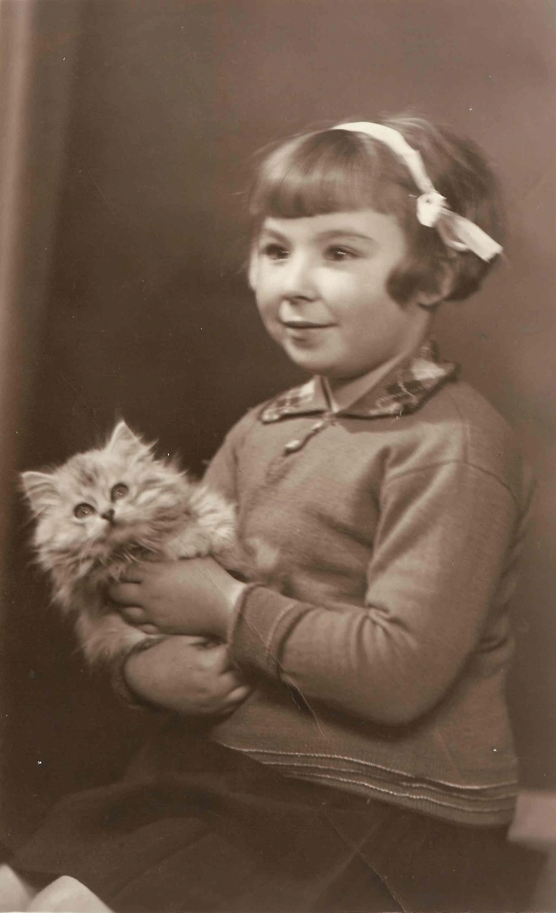 Grace Enid Baglin (1933-2006); holding silver tabby - Michael.
