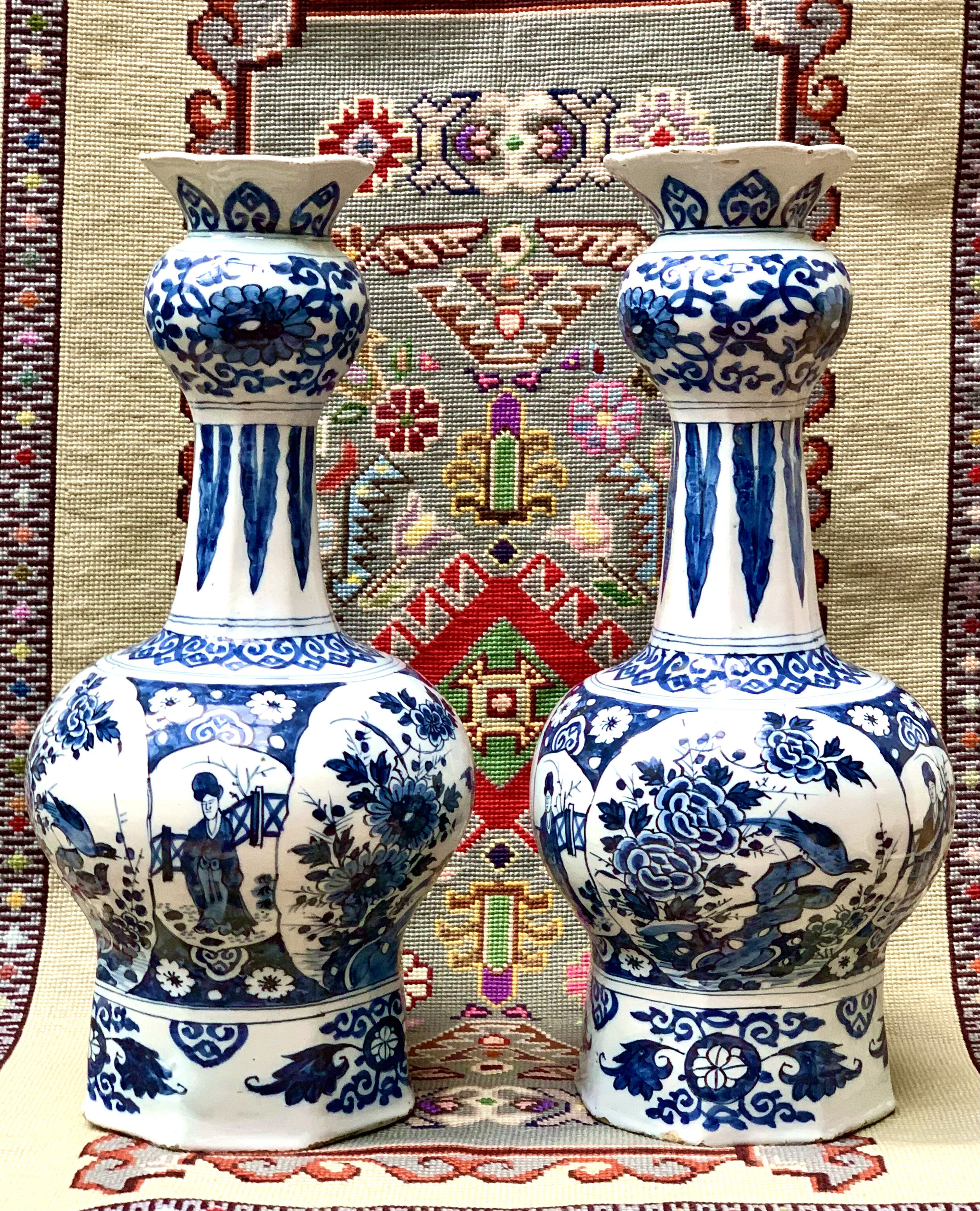A pair of Dutch Royal Delft Onion-necked Vases circa 1690 in the Chinese style, Blue Delft Porcelain in a fine condition. Height 42 cm Price on Application