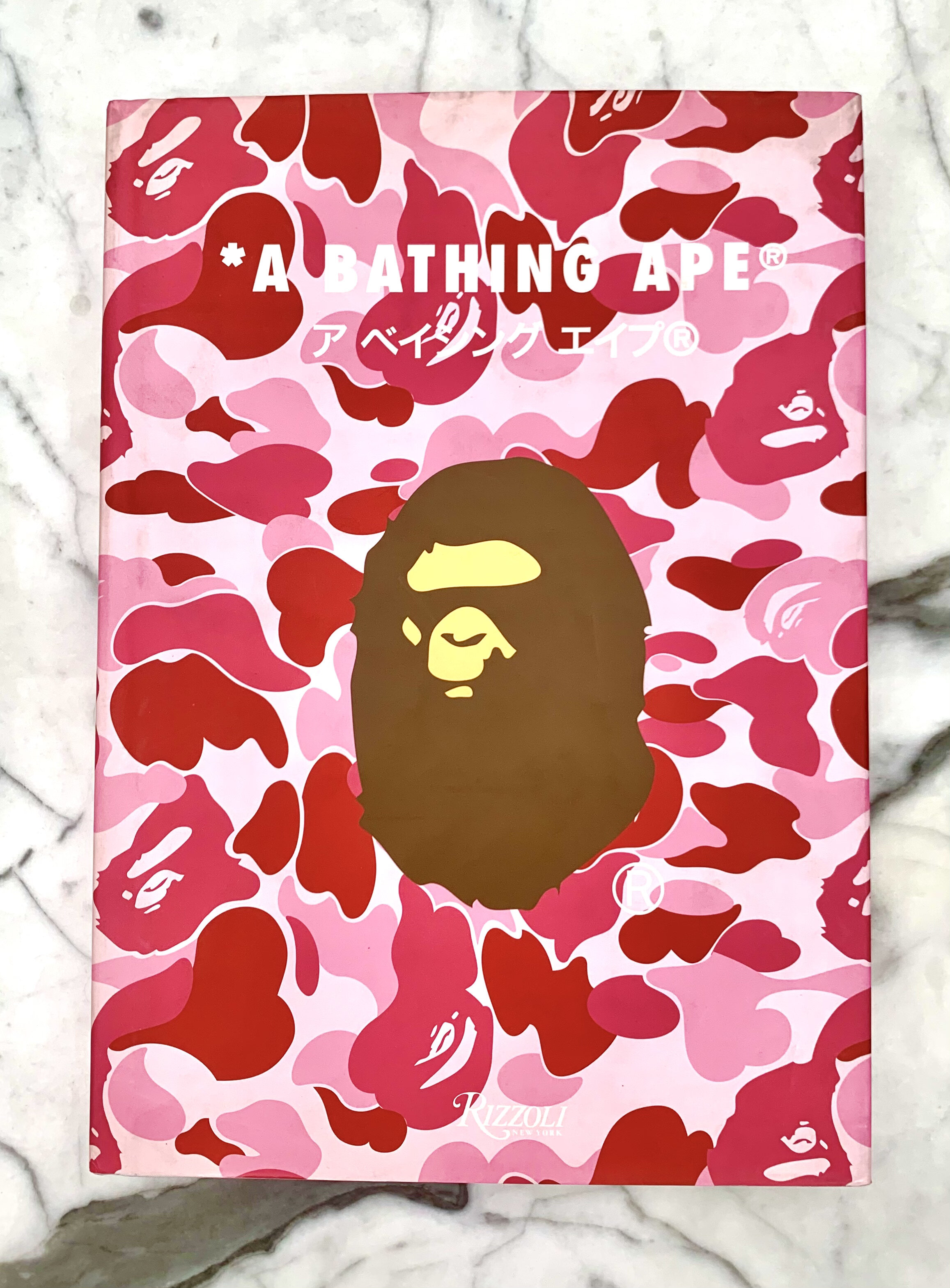 A Bathing Ape - Nigo with Akio Iida & Ian Luna, Rizzoli 2008. 1st Edition in a New Condition. Pink Camouflage Dust Jacket the most out of the 3 different jackets, £750.00