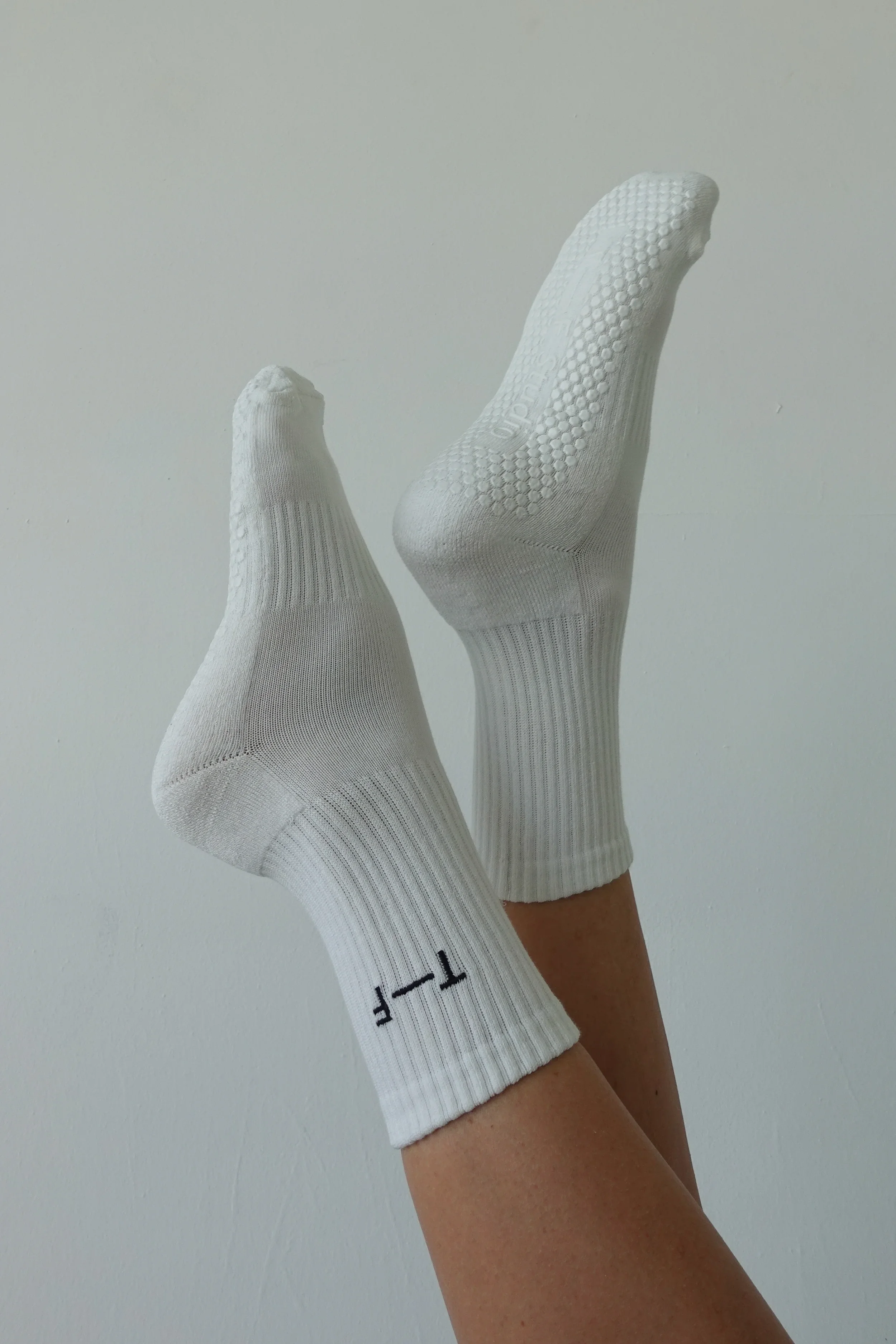  T-F Studio Grip Socks - $22  
Why do all grip socks have contrast colour grips and short cuffs that slip off? We love that Bust client   Tasha  has created the perfect ones in 3 colours: padded, subtle, ribbed cuffs - we're obsessed