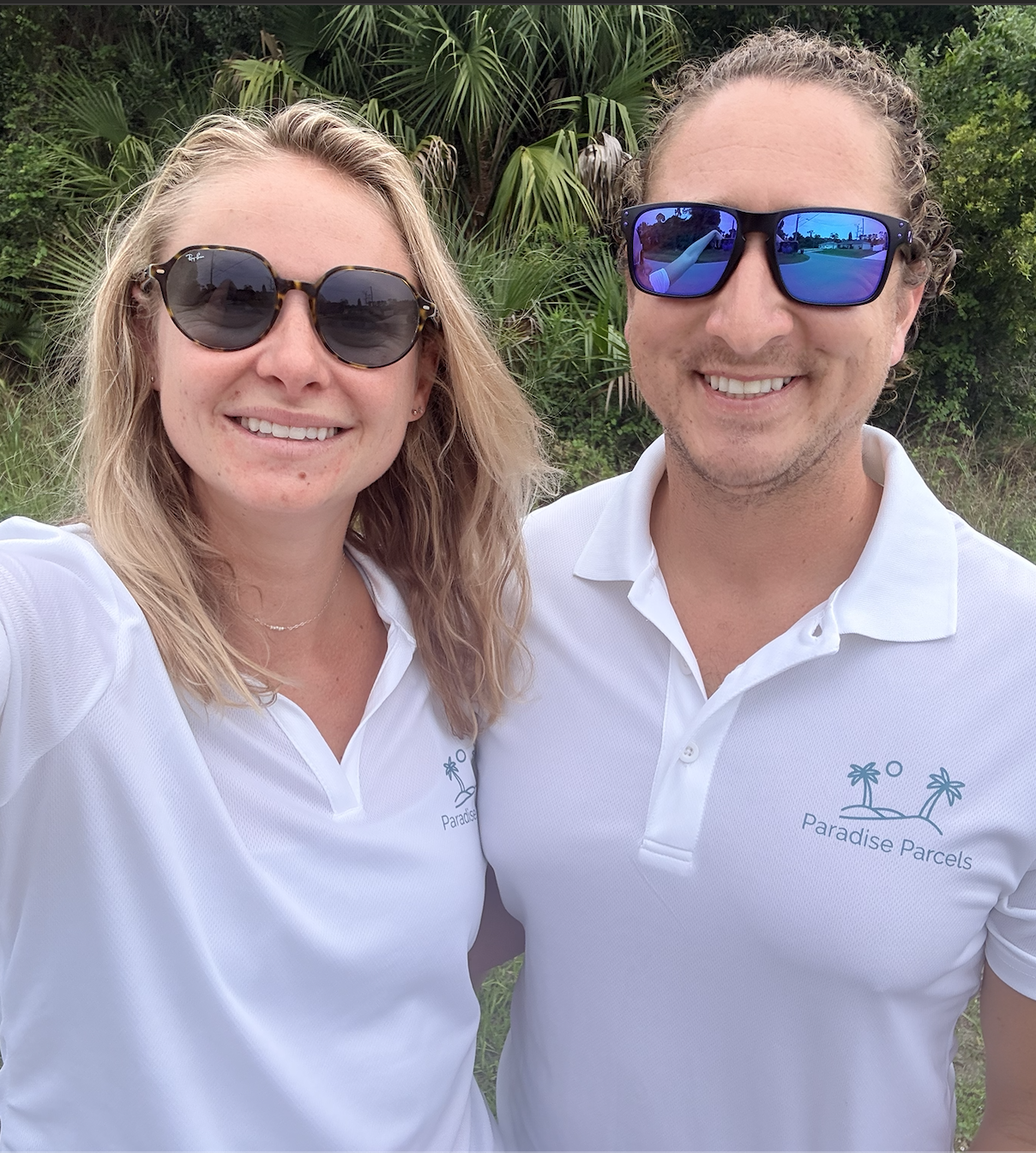 Chloe and Evan Of Paradise Parcels In Front of a For Sale By Owner Property For Sale