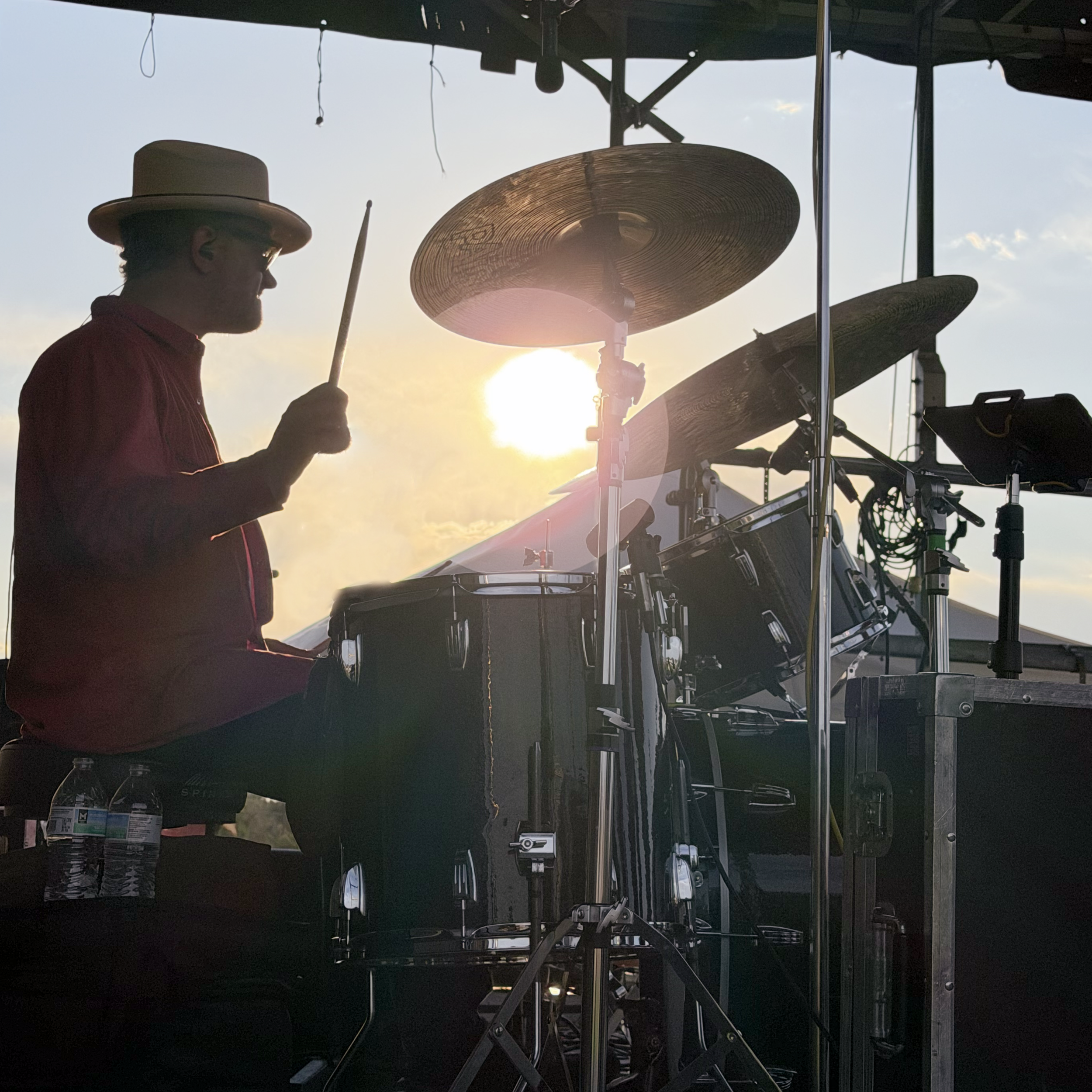 Ryan Elwood drumming at sunset, photo by Ryan Chrys