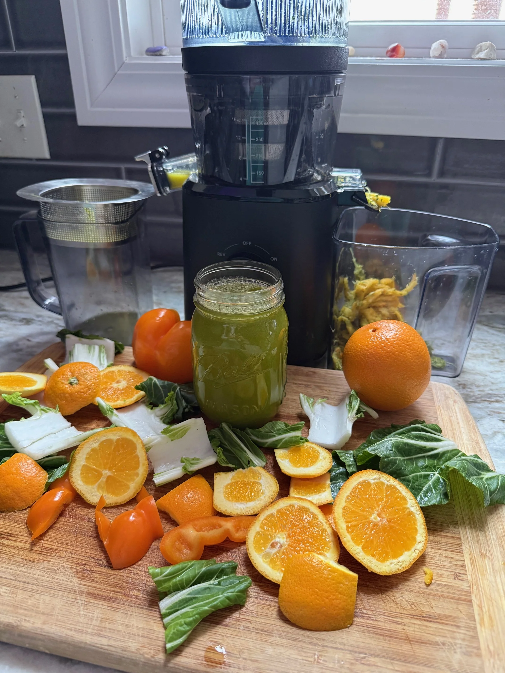 Fresh hormone balancing juice made with bok choy, orange pepper and oranges for natural remedies for estrogen dominance in perimenopause.