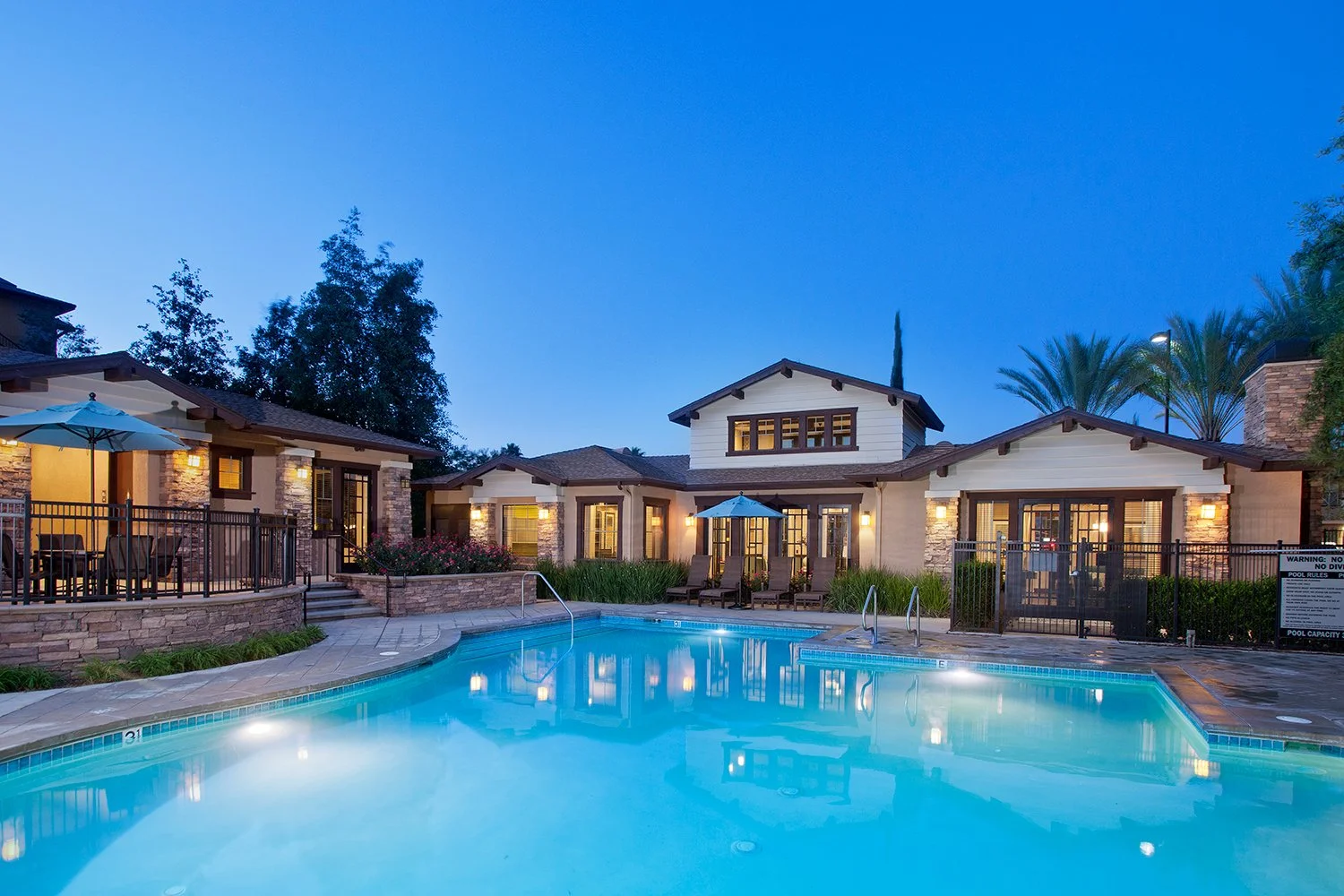 Overlook Pool Area with gorgeous resort style pool and luxurious relaxing spa overlooking the mountain ranges and blue sky