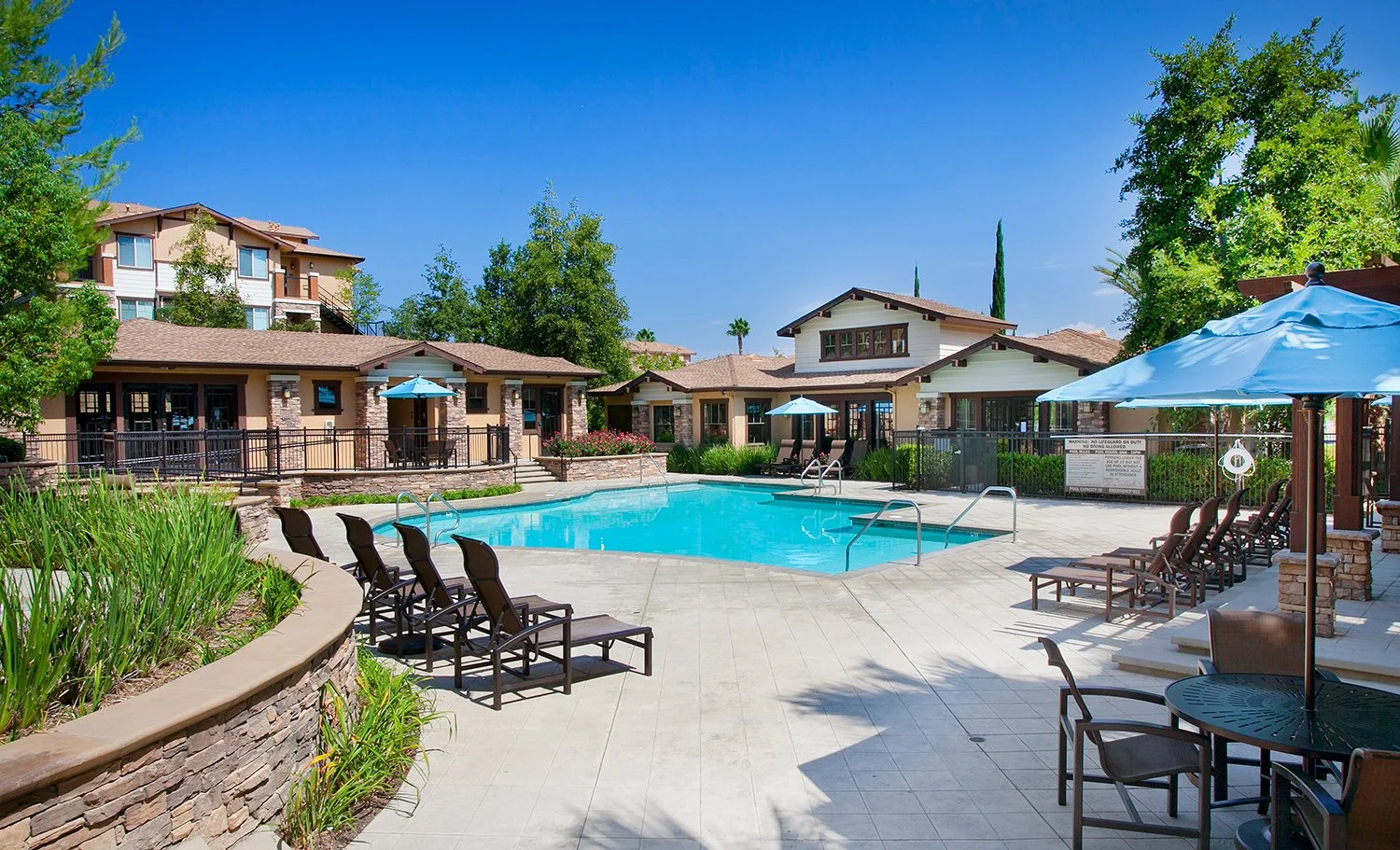 Overlook Pool Area with gorgeous resort style pool and luxurious relaxing spa overlooking the mountain ranges and blue sky