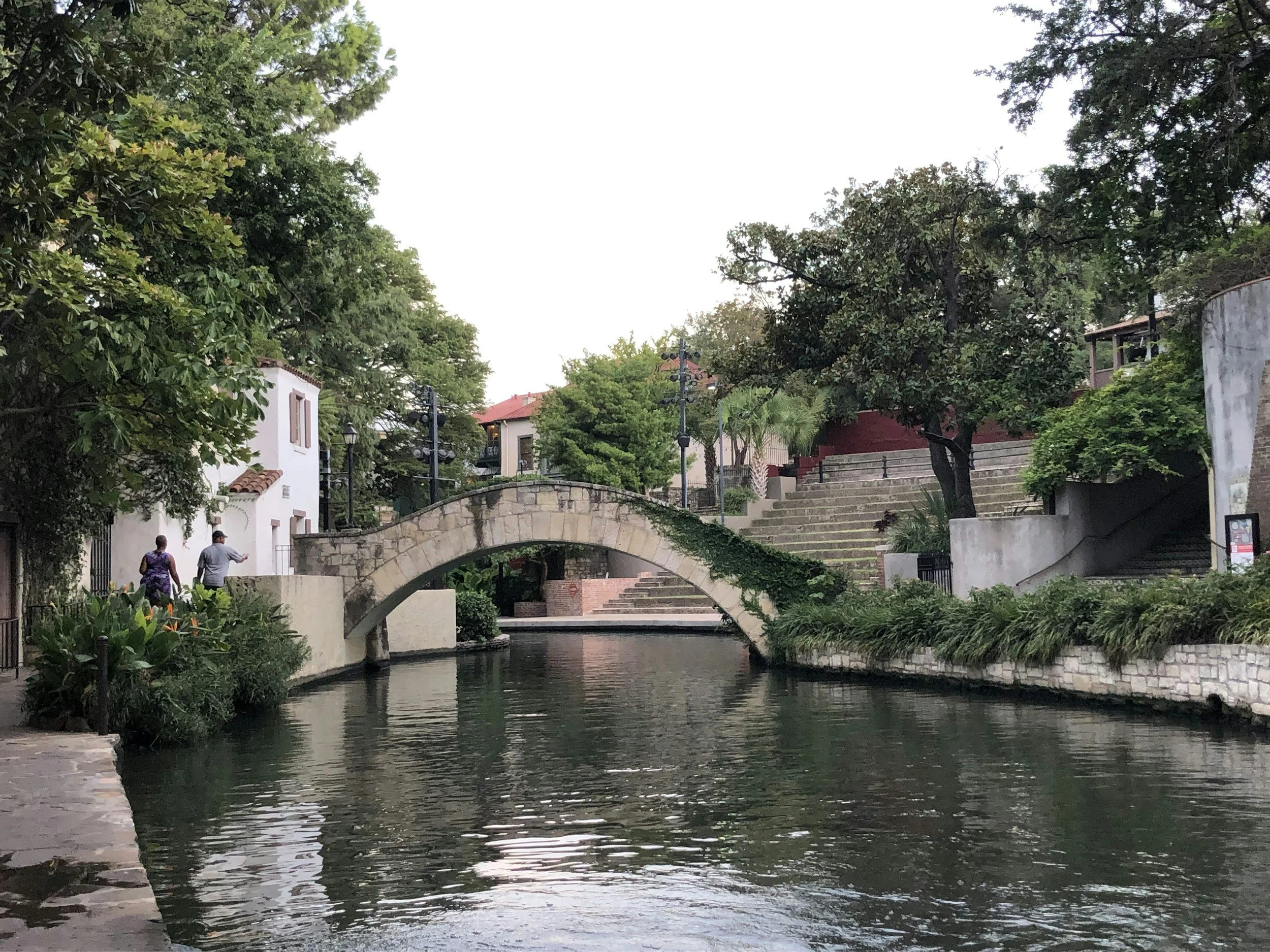 San Antonio Texas River Walk with stone bridges and evening light