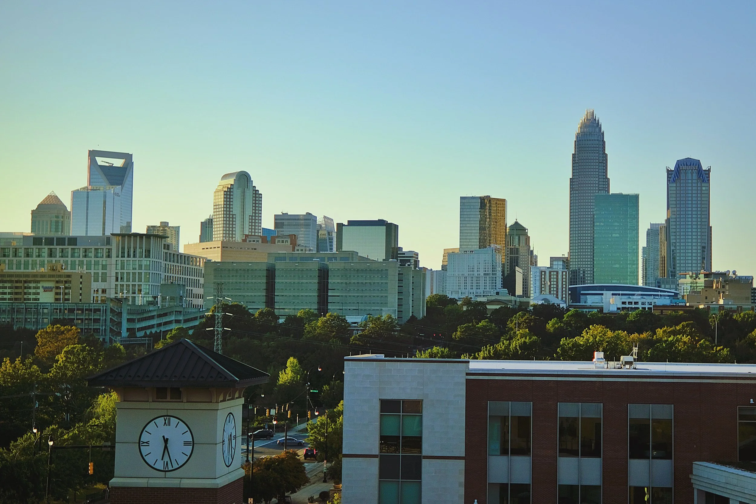 Charlotte North Carolina skyline with modern buildings and sunset sky