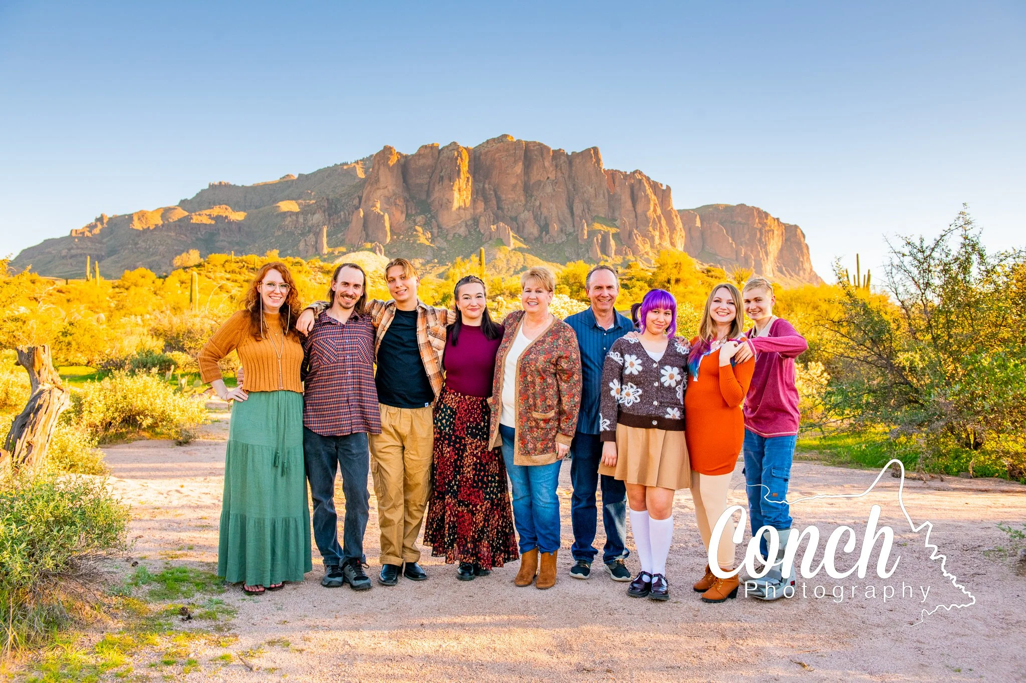 Large Family at golden hour in the desert at First Water Trailhead with the Superstition Mountains behind them