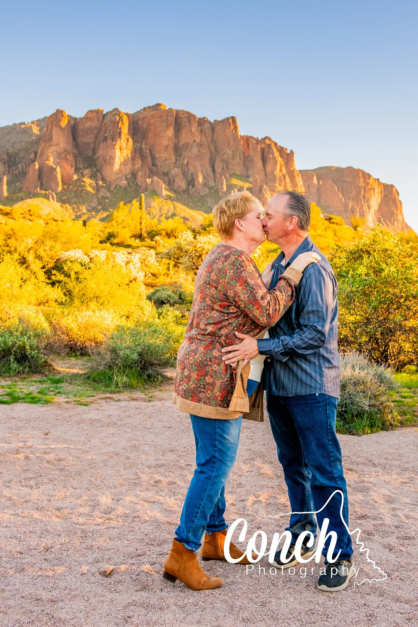 Husband and Wife Kissing at First Water Trailhead