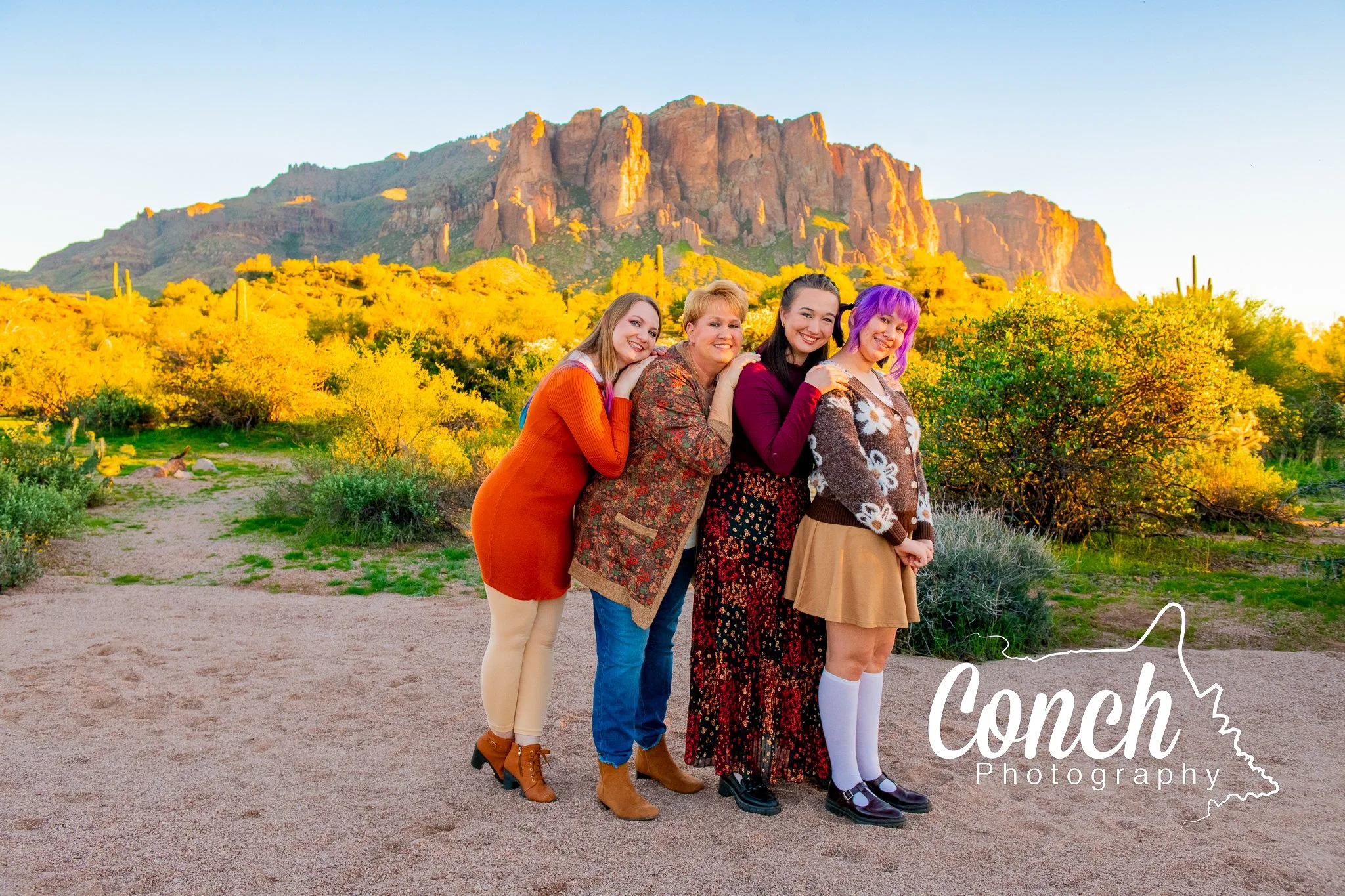 Silly wide shot of a Mom and her three daughters at First Water Trailhead