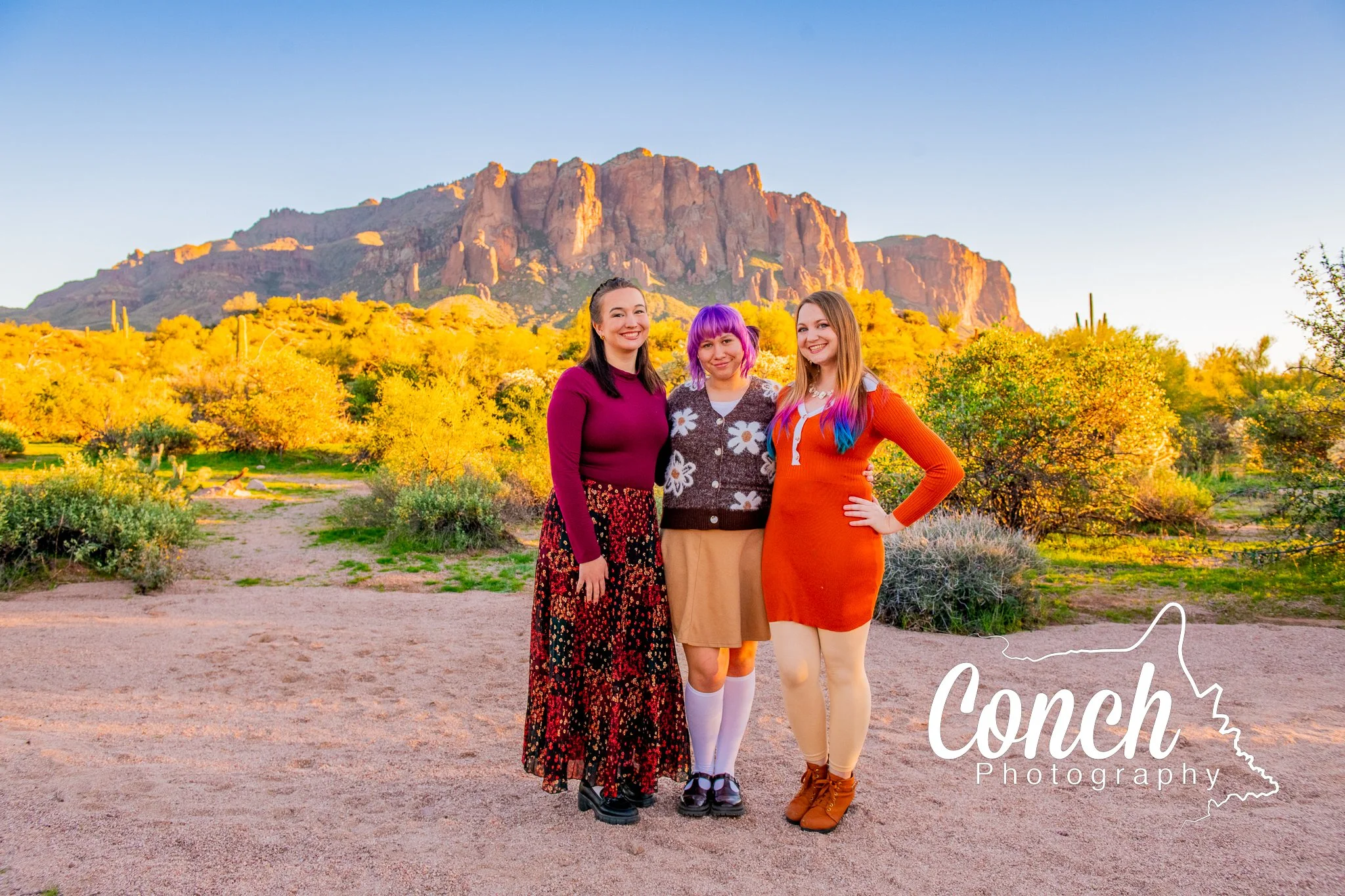 Wide angle shot of three daughters at First Water Trailhead