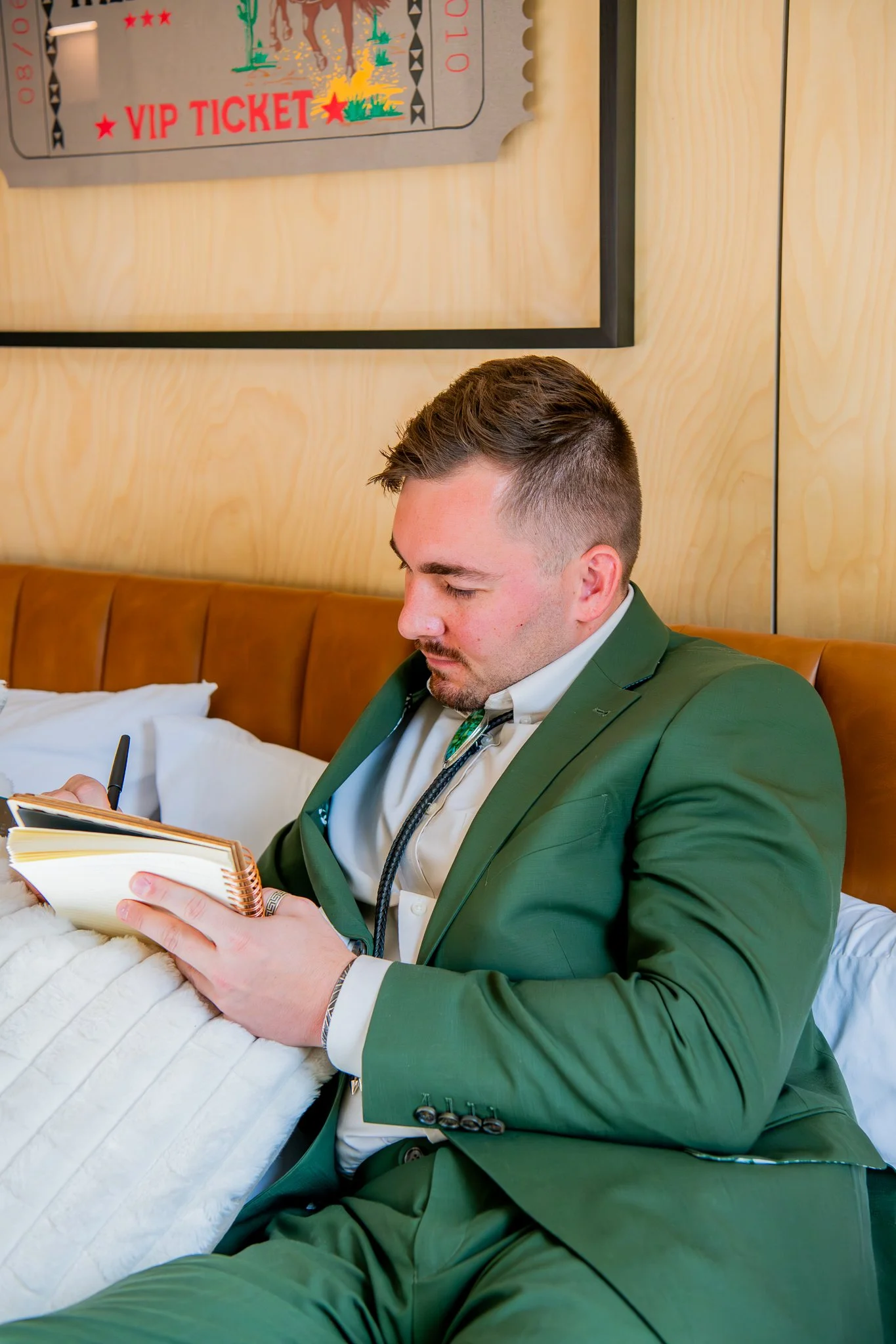 Groom transcribing vows before elopement