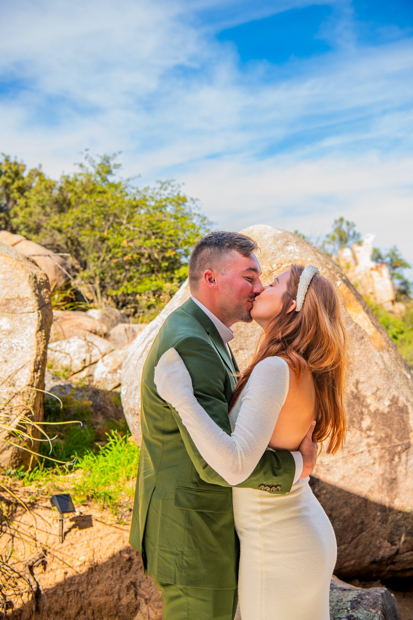 Groom kissing bride during their first look in Prescott, Arizona