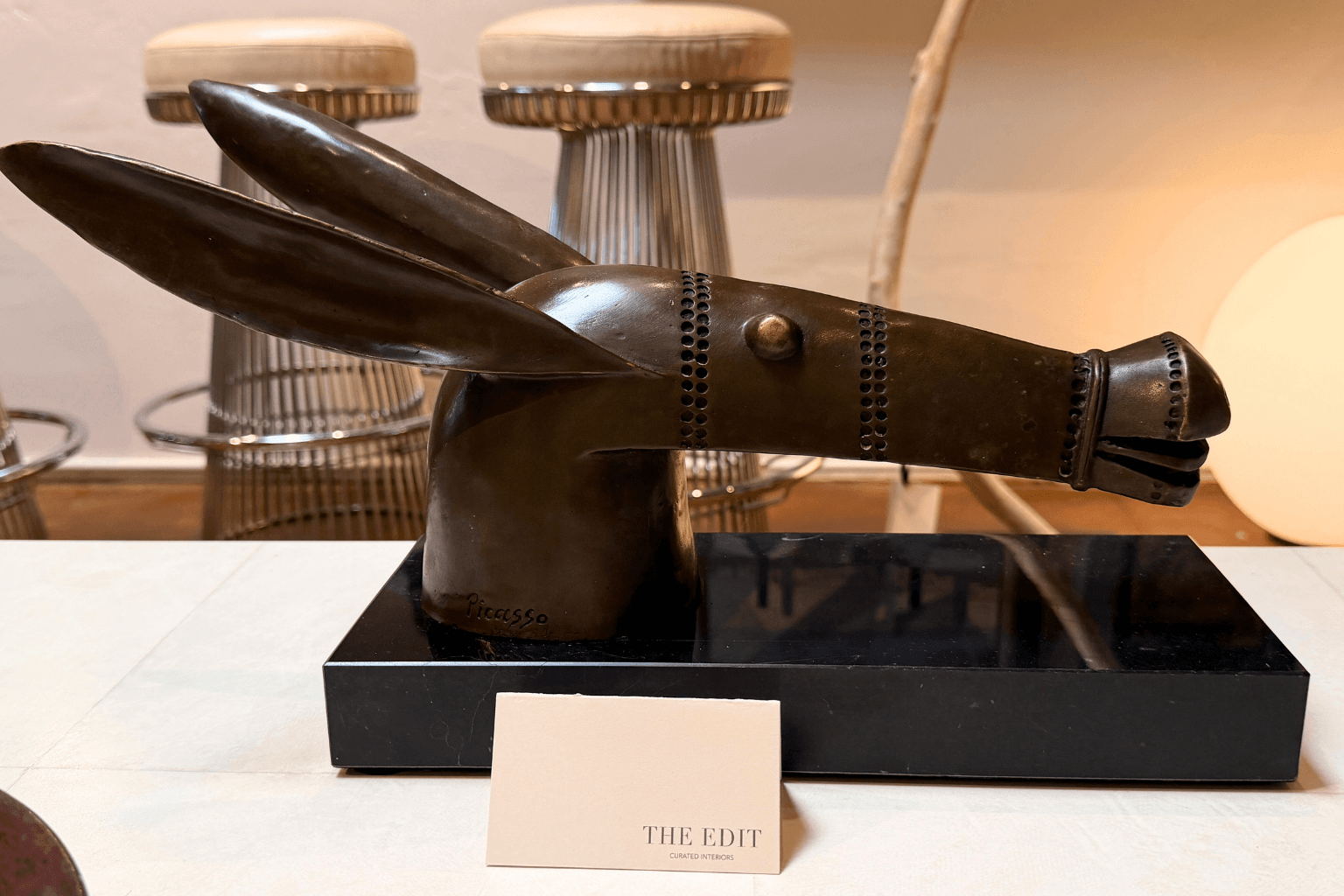 Travertine, unlacquered brass, burl wood, raw linen — surfaces that invite touch and reward a second look. Highly textured sculptures.