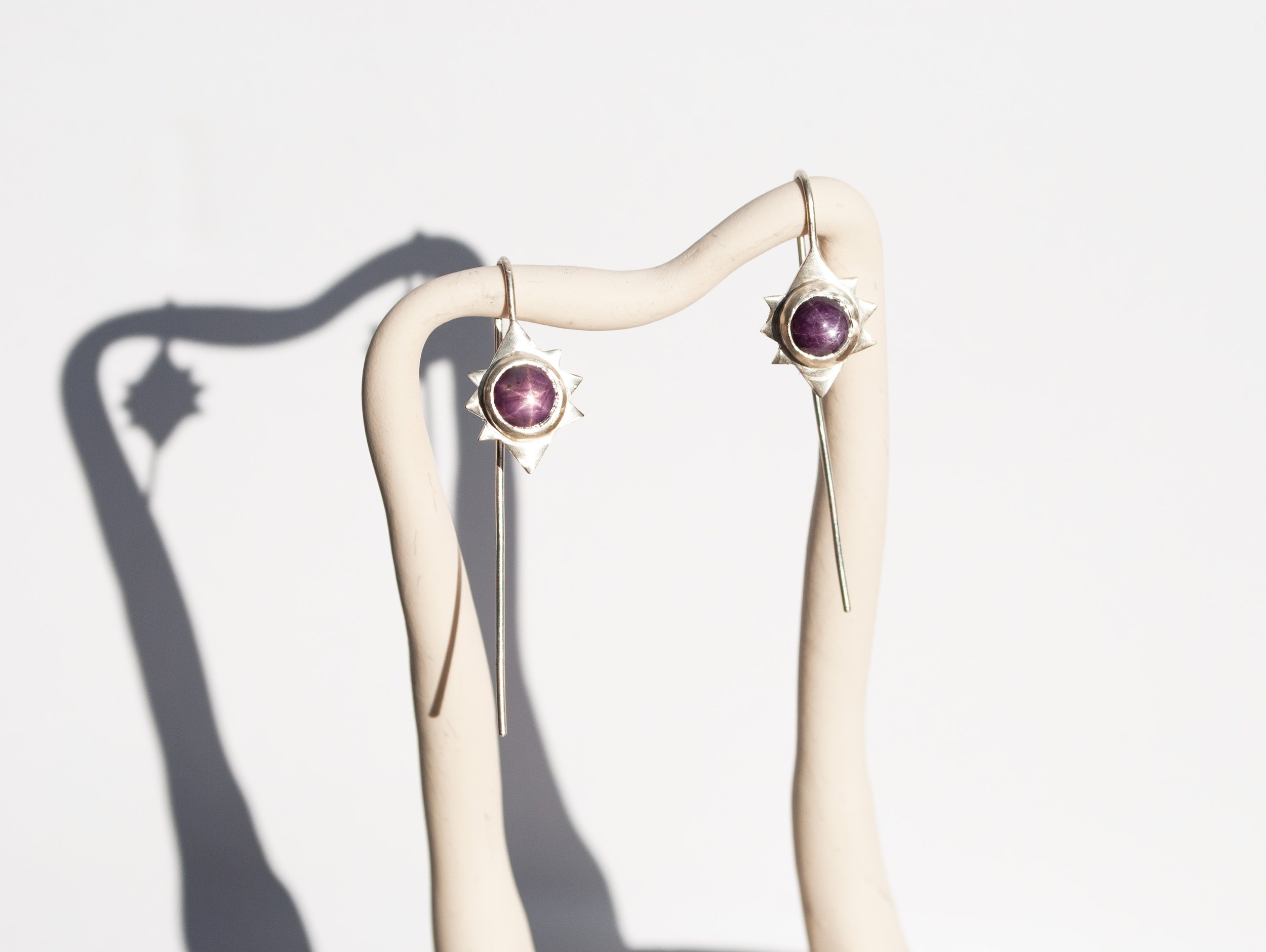sterling star ruby sunburst drop hanging.jpg