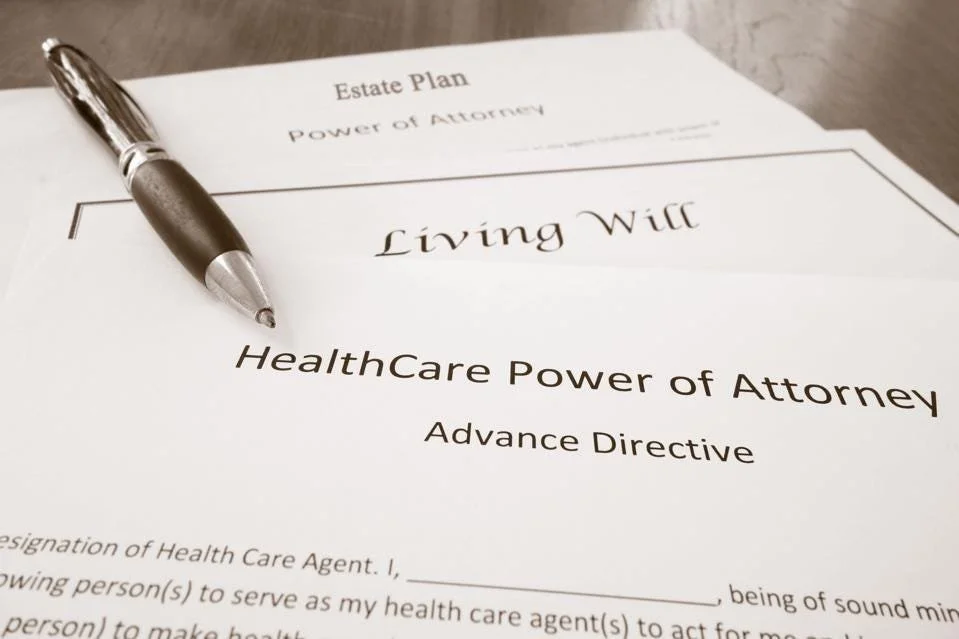 Typed documents Healthcare Power of Attorney, Living Will  and Estate Plan with stylish pen