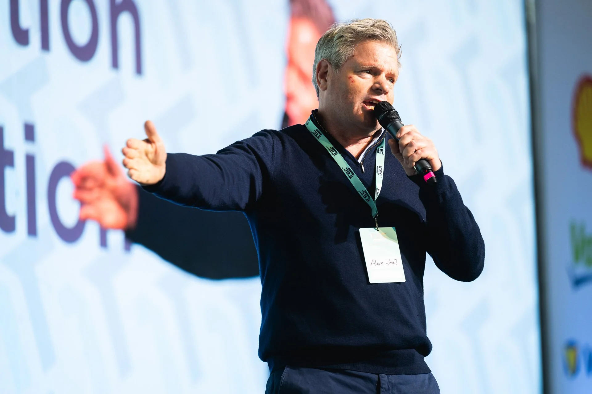 mark durden-smith on stage hosting a conference
