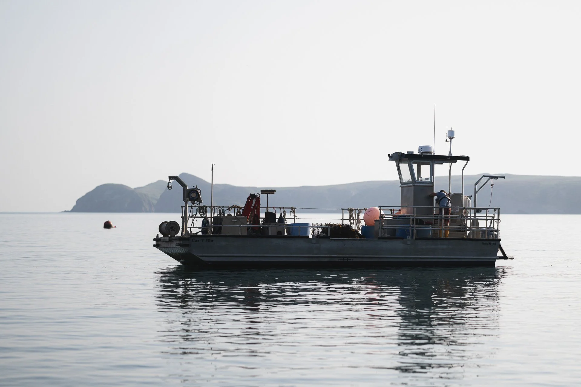 Câr-y-Môr working boat on calm water off the Pembrokeshire coast.