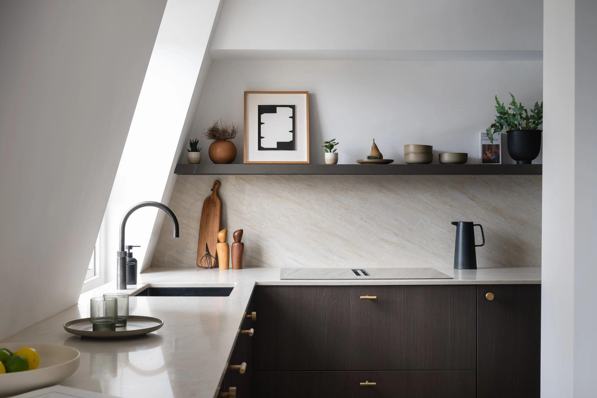 Compact kitchen beneath a sloping ceiling