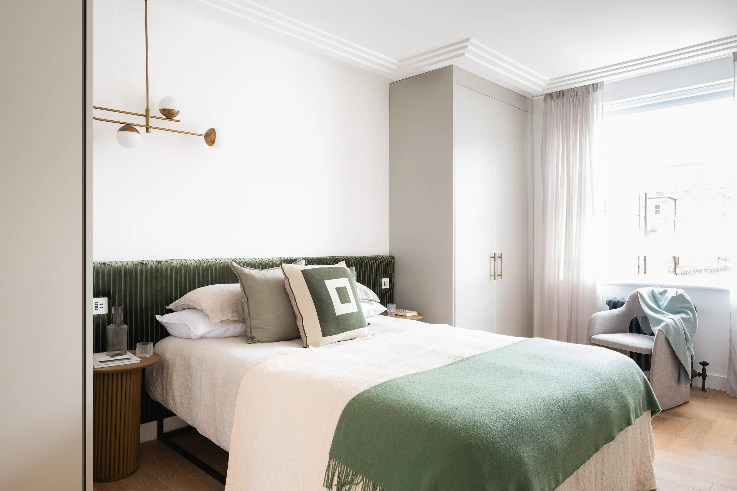 Bedroom framed by an arched doorway