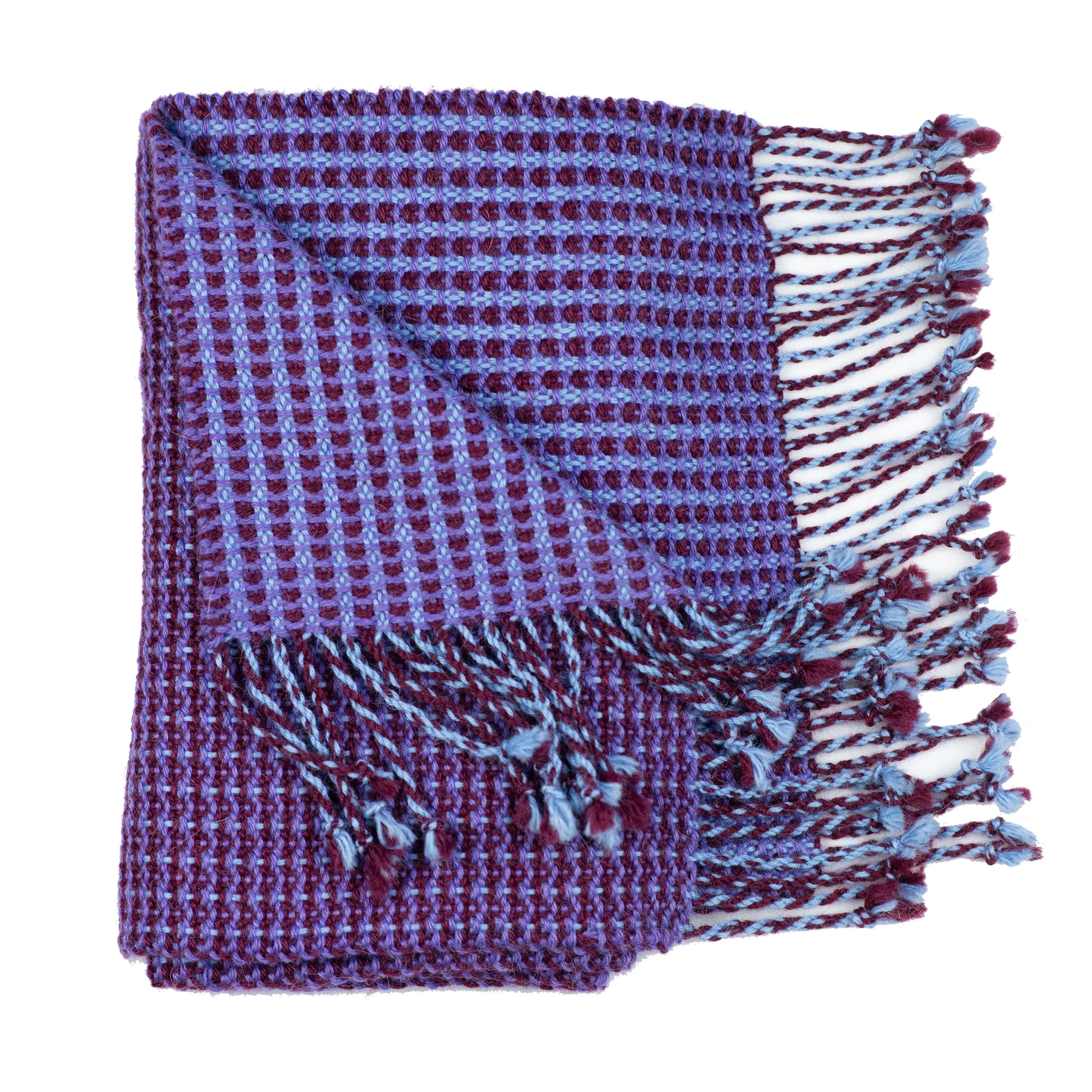 Alpaca scarf in shades of purple and blue, folded to show different pattern on the reverse side.
