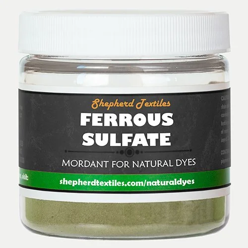 A plastic jar full of greenish powder labeled "Ferrous Sulfate."