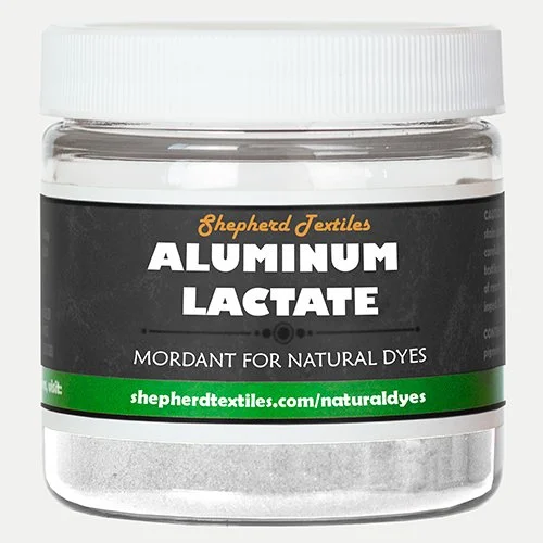 A plastic jar filled with white powder labeled "Aluminum Lactate."