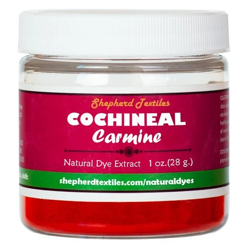 A plastic jar full of red powder labeled "Cochineal Carmine".