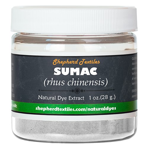 A plastic jar full of white powder labeled "Sumac".