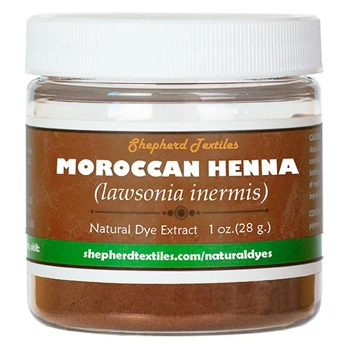 A plastic jar full of brown powder labeled "Moroccan Henna".