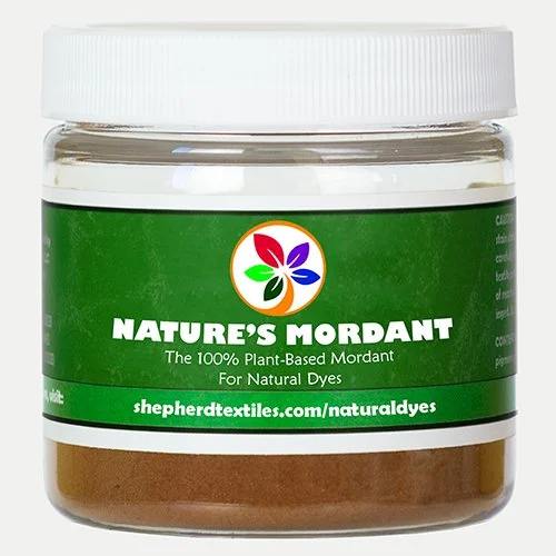 A plastic jar filled with brown powder labeled "Nature's Mordant."