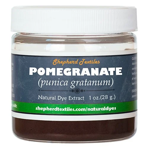 A plastic jar full of brown powder labeled "Pomegranate".