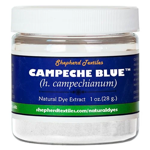 A plastic jar full of white powder labeled "Campeche Blue".