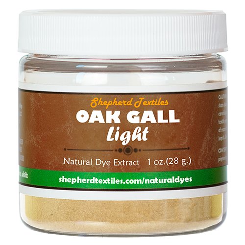 A plastic jar full of brown powder labeled "Oak Gall Light".
