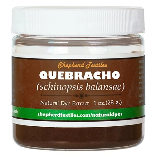 A plastic jar full of brown powder labeled "Quebracho".
