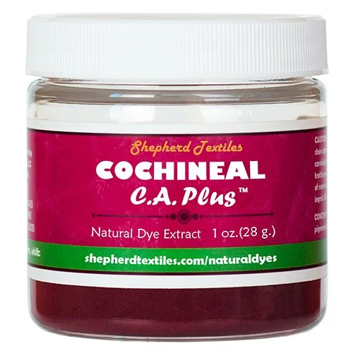 A plastic jar full of purple powder labeled "Cochineal CA Plus".