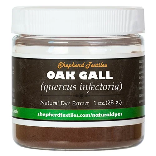 A plastic jar full of brown powder labeled "Oak Gall".
