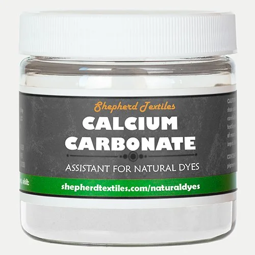 A plastic jar full of white powder labeled "Calcium Carbonate."