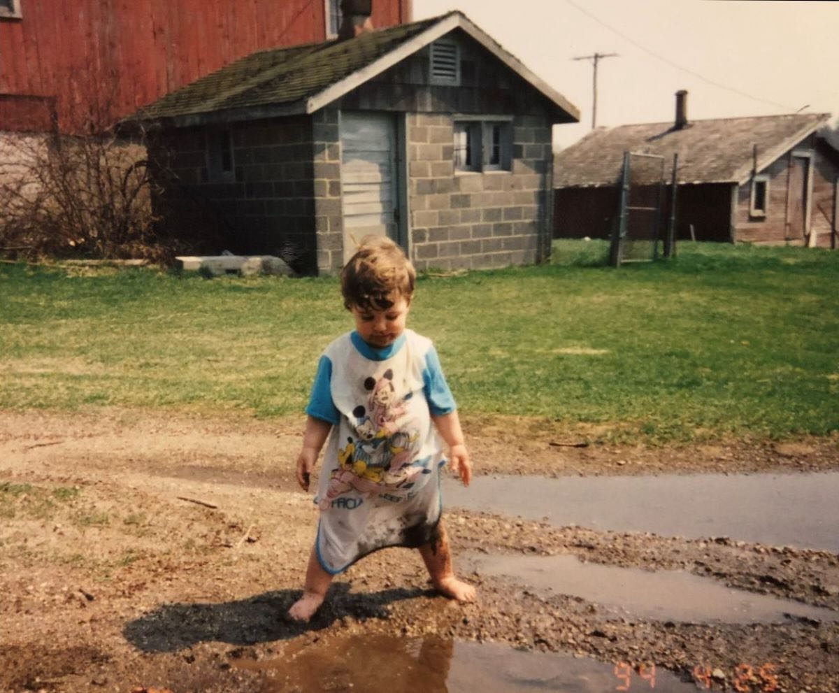 This is the person who grows your flowers, answers your emails, stocks your favorite little farm stand, and so much more.

Forever covered in dirt and barefoot.

This farm has changed in so many ways since this pic and I treasure these old photos to 
