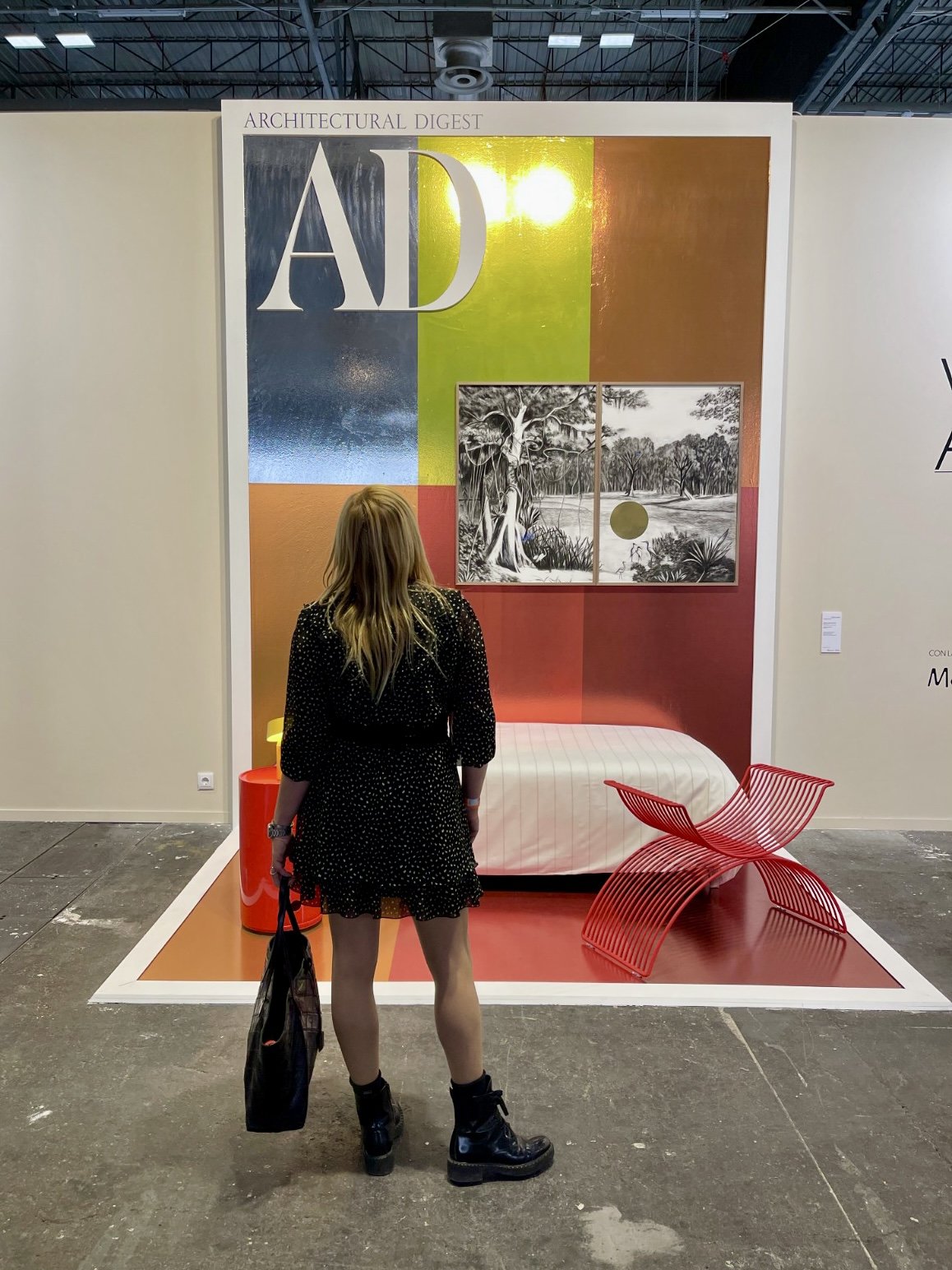 Gabby in front of one of the especially curated life-size AD magazine covers. 